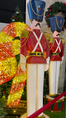 Nutcracker Soldier statues at the Merry Christmas event in December, the end-of-year holiday. The brave soldiers cracking nuts. Christmas decoration.