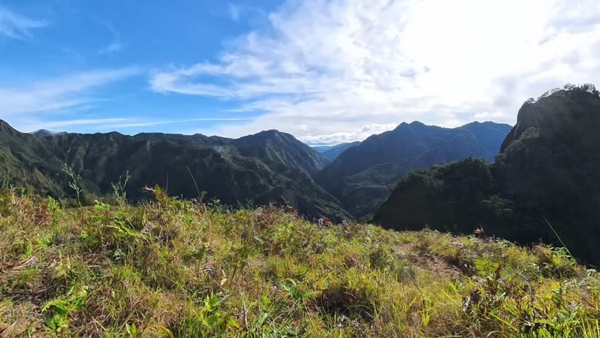 Scenic hiking along a scenic mountain trail with trees and natural landscape in the Bakun Benguet, Philippines.