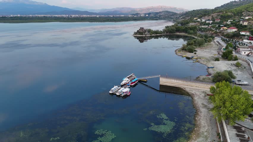 stunning 4k drone footage of shkoder lake in albania capturing serene waters surrounding mountains and timeless history watch the history