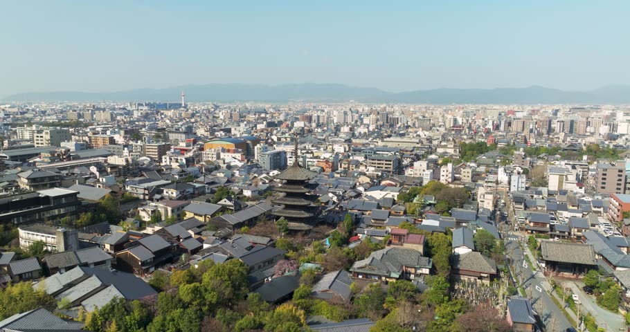 Japanese town of Kyoto at sunrise, aerial view of Yasaka pagoda, famous Japanese tourist destination in the morning, flying around famous shrine of Yasaka pagoda Kyoto japan.