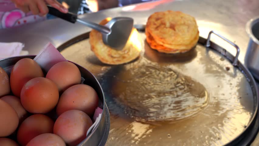 Thai Food Banana Roti – Exotic Banana Pancake Dessert Cooked at Local street Market Thailand