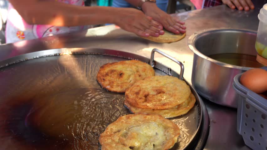 Thai Food Banana Roti – Exotic Banana Pancake Dessert Cooked at Local street Market Thailand