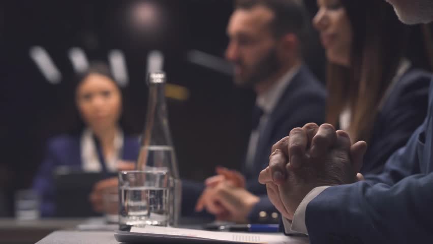 Politics, group man woman with speech at conference for delegation, committee decision or feedback. People, global forum and politician panel with discussion for government initiative and legislation