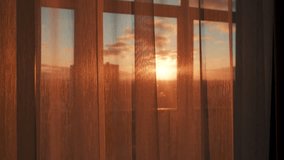 Sunset light gently fills rooms. Twilight casts glow on indoor spaces. Evening glow softly highlights interior and creates welcoming shades. Shine through window through transparent tulle - Powered by Shutterstock - Get 15% off with code: PIKWIZARD15