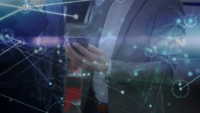 Animation of data processing over caucasian businessmen using smartphone. Global business and digital interface concept digitally generated video. - Powered by Shutterstock - Get 15% off with code: PIKWIZARD15