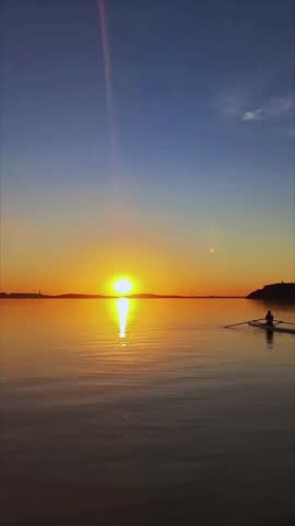 Romantic tropical sunset with blue and red magical sky over calm sea.