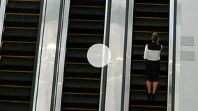 Animation of network of connections with icons over businesswoman on escalator. Global business and digital interface concept digitally generated video. - Powered by Shutterstock - Get 15% off with code: PIKWIZARD15