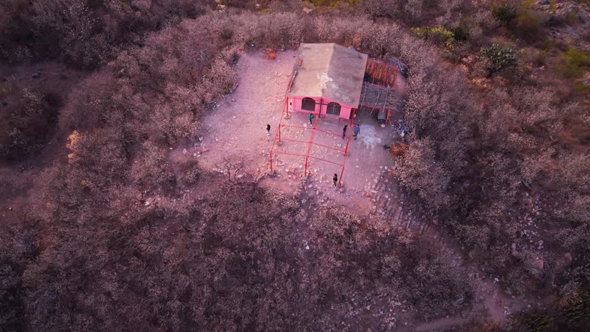 Top-down aerial of a Catholic chapel visit on a hill, Oaxaca
