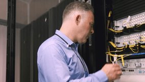 Animation of nft text over caucasian businessman in server room. global business, technology and digital interface concept digitally generated video. - Powered by Shutterstock - Get 15% off with code: PIKWIZARD15