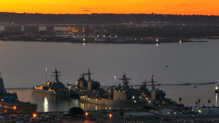 Aerial view of naval ships at dusk, United States.