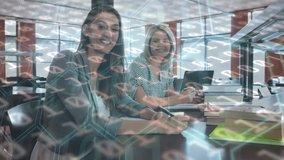 Animation of binary code over smiling caucasian coworkers working in library. Digital composite, multiple exposure, education, coding, togetherness, teamwork, profession concept. - Powered by Shutterstock - Get 15% off with code: PIKWIZARD15