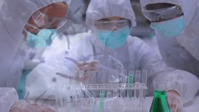 Animation of virus cells over diverse male and female scientists working in lab. Science, medicine and pandemic concept digitally generated video. - Powered by Shutterstock - Get 15% off with code: PIKWIZARD15