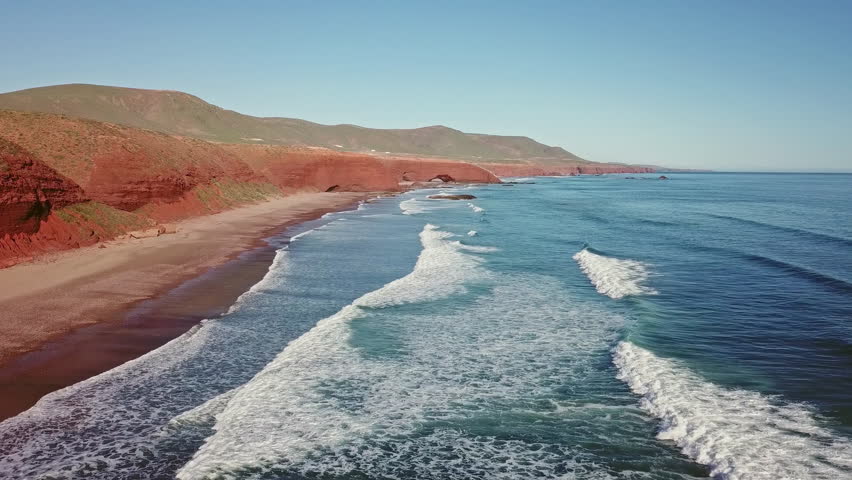 Aerial view on Legzira beach with arched rocks on the Atlantic coast in Morocco, 4k