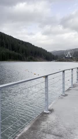 Bukovel forest landscape with pond and ferris wheel in Ukraine