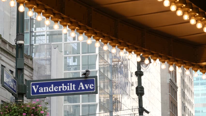 Grand Central Terminal on East 42 street, New York City Manhattan Midtown. Railway building entrance in United States. American public railroad transport. Vanderbilt avenue road sign and light bulbs.