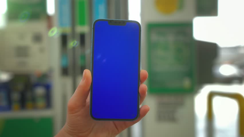 Man holding and swiping phone chroma key screen in the park walking on the street, smartphone close up in hands, Girl with green screen on smart phone. 