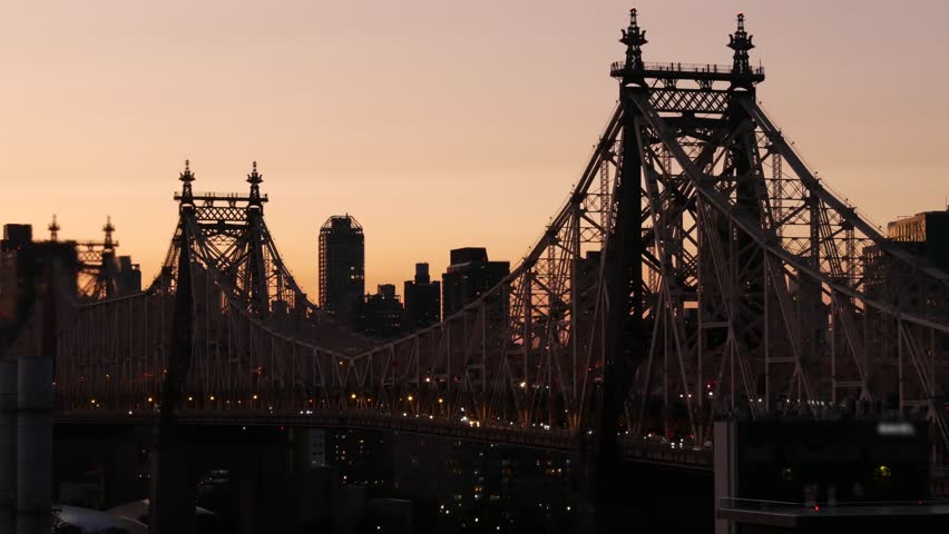 New York City Manhattan Midtown skyline from Queens, Queensboro bridge architecture, United States. Rooftop cityscape from Long Island Hunters Point. Urban sunset twilight dusk dark evening silhouette