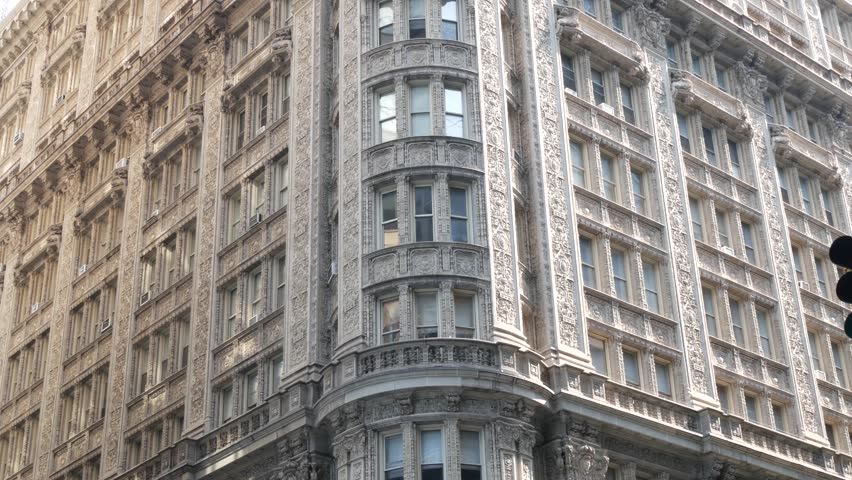 New York City Manhattan Midtown historic building 1909, facade architecture, United States of America. Real estate property on 7 seventh avenue. Classic style design landmark. Corner symmetry, windows