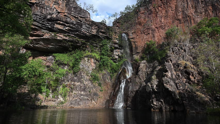 sandy creek falls, Tjaynera, a beautiful and remote waterfall in Litchfield in the arid outback of the Northern Territory, popular travel destination in Australia.