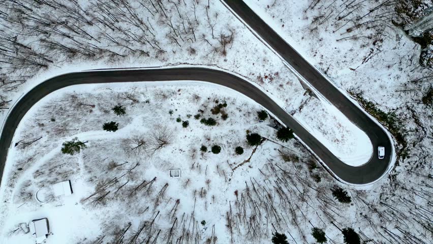 Raccolana Valley and the Fontanone di Goriuda waterfall in the snow in winter. 