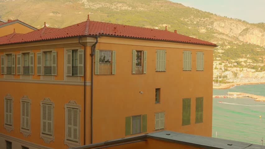 Traditional colorful houses and sea view in the old town of Menton, France