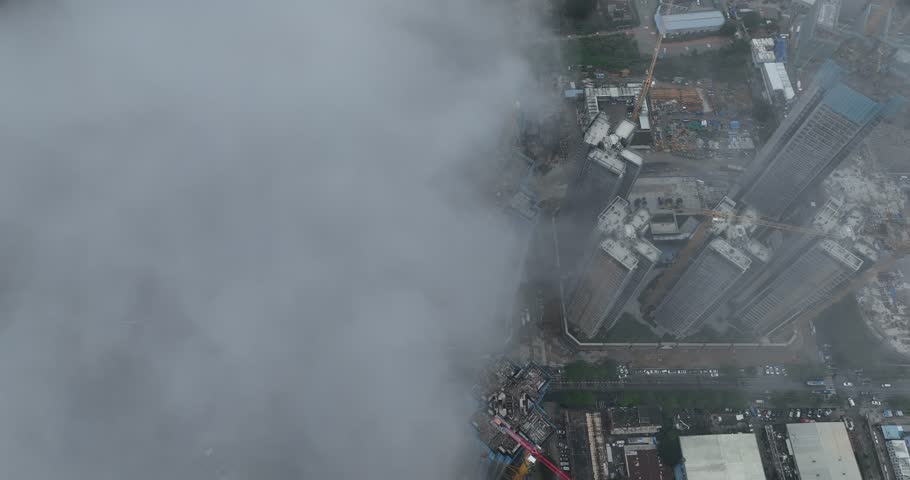 Shenzhen ,China - April 07 2024: Aerial footage of modern apartment houses under construction in shenzhen city, China