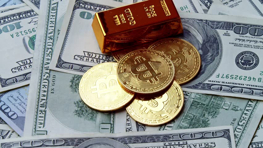Close Up Shot Of Shiny Bitcoin Cryptocurrency Coin Lying On One Hundred Dollar Bills. Symbol Of Digital Finance Investment And Modern Economic Innovation.