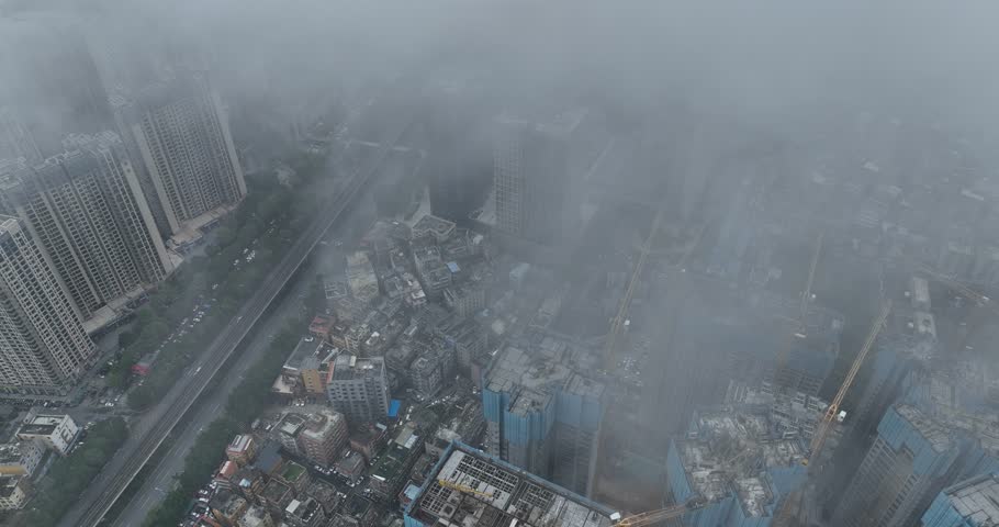 Shenzhen ,China - April 07 2024: Aerial footage of modern apartment houses under construction in shenzhen city, China
