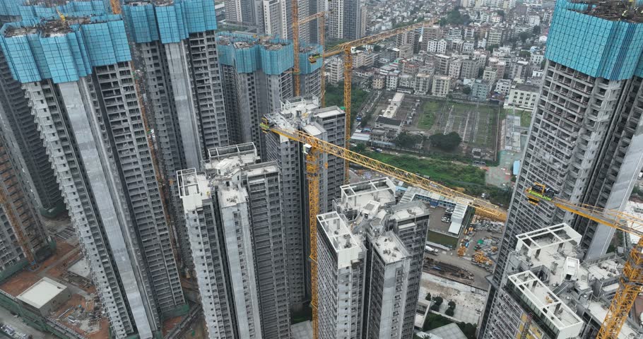 Shenzhen ,China - April 07 2024: Aerial footage of modern apartment houses under construction in shenzhen city, China