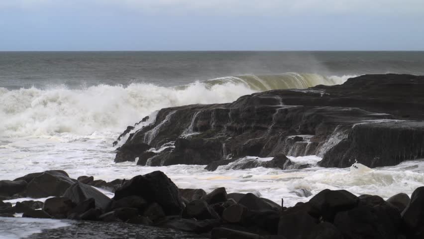 Rocky coastal shore with crashing ocean waves