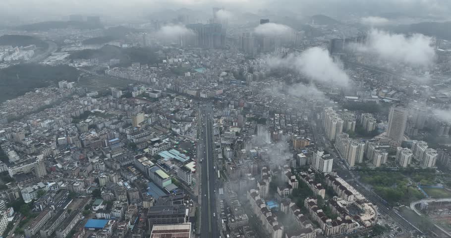 Shenzhen ,China - April 07 2024: Aerial footage of modern apartment houses under construction in shenzhen city, China