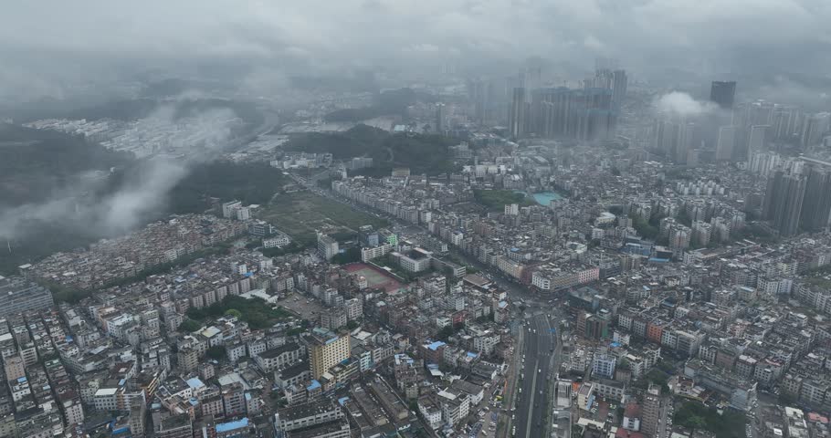 Shenzhen ,China - April 07 2024: Aerial footage of modern apartment houses under construction in shenzhen city, China