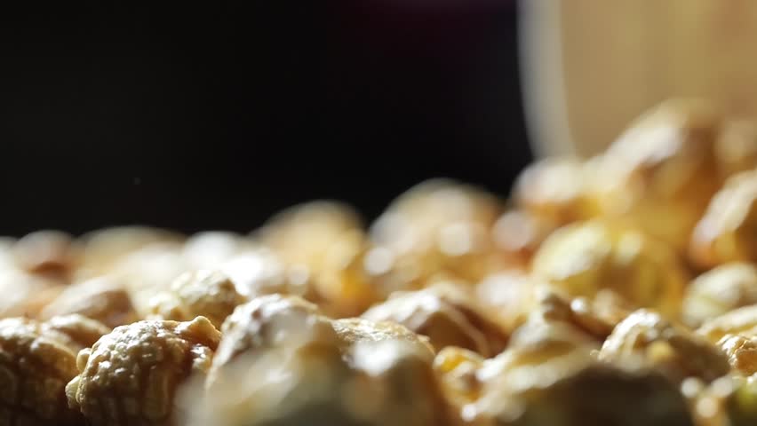 Slow Motion Caramel Popcorn Falling into Pile
