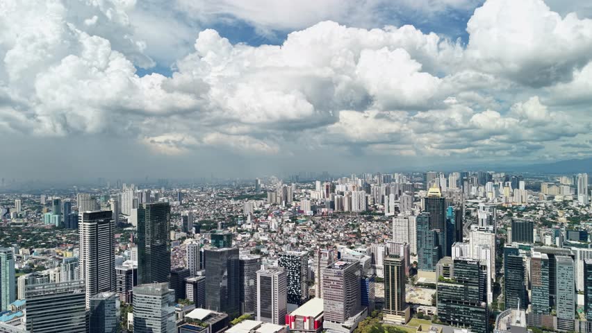Cinematic aerial footage presents an expansive panoramic view over Bonifacio Global City, Manila
