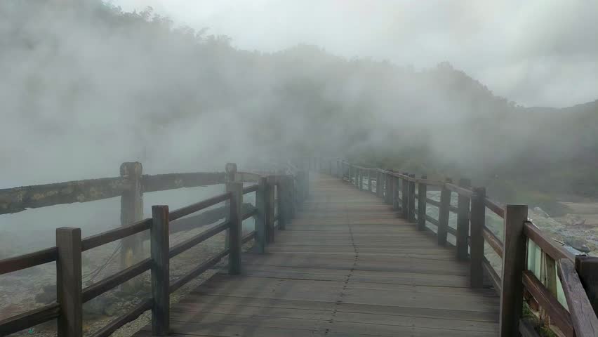 active geothermal activity in the form of hot mud eruptions, thick clouds of sulfur smoke, and colorful hot water pools that emit dangerous gases