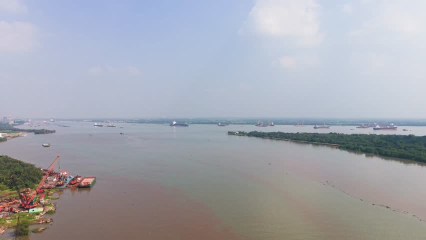 Aerial View Dolly of Ships Navigating the Saigon River.
