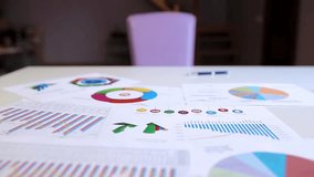 Businessman analyzing statistics on charts and graphs in an office, illustrating data analysis, business strategy, and corporate decision-making. - Powered by Shutterstock - Get 15% off with code: PIKWIZARD15