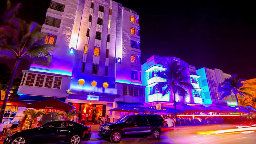 Vibrant nightlife on South Beach, Miami, featuring illuminated Art Deco buildings, bustling streets, and colorful evening city vibes.