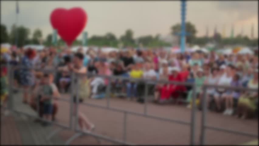 People Watch Performance At Summer City Festival.