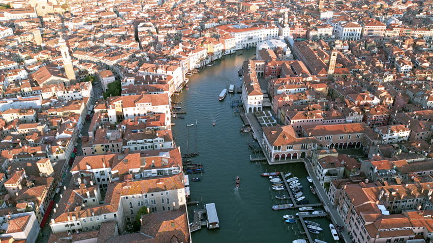 Venezia aerial view. Venice Grand Canal and San Marco Square from drone. Venezia cityscape at dusk. Venice famous city. Venice panorama. Venice along canals with gondola.