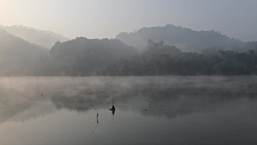 Beautiful morning fogs over the hull side lake