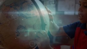 Animation of network of connections with icons over african american boy with globe at school. learning geography, education, connections and technology concept digitally generated video. - Powered by Shutterstock - Get 15% off with code: PIKWIZARD15