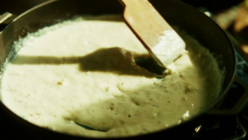 White Creamy Sauce For Pasta. Cooking Cheese Italian Food. White Yogurt Sauce. Mediterranean Cuisine. Bechamel Sauce. Homemade Boiling Tasty Spaghetti Topping. Traditional Recipe Italian White Sauce