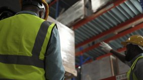 Blue collar workers are working at warehouse. Logistics, transportation. - Powered by Shutterstock - Get 15% off with code: PIKWIZARD15