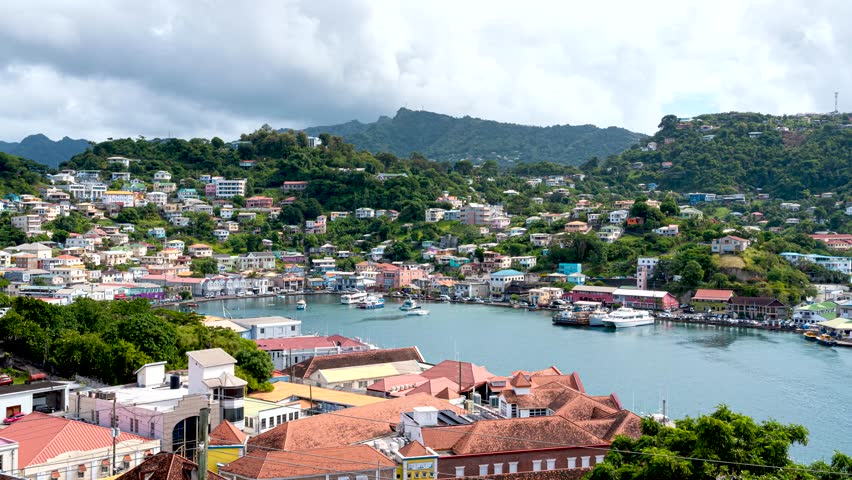 Motion timelapse over inner harbor of tropical Caribbean St. George's in Grenada
