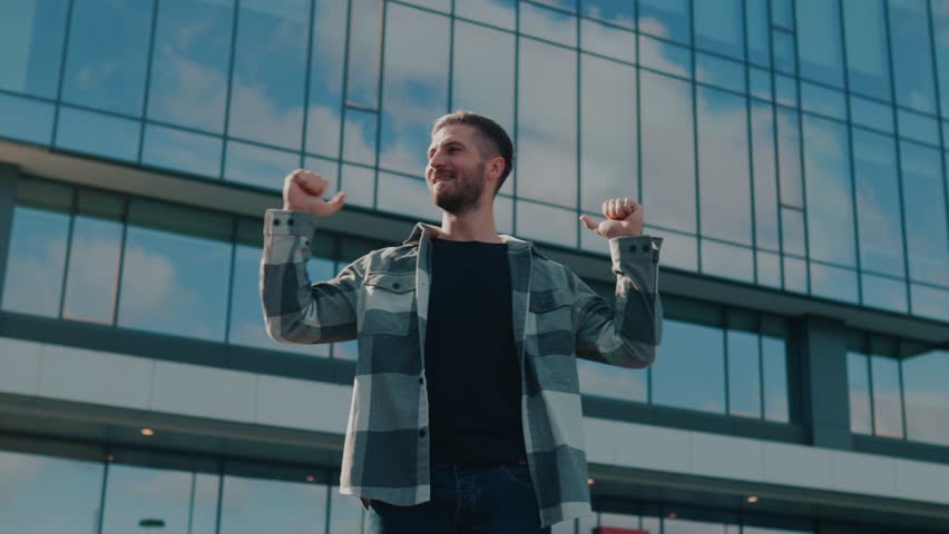 A happy American man, bathed in the city