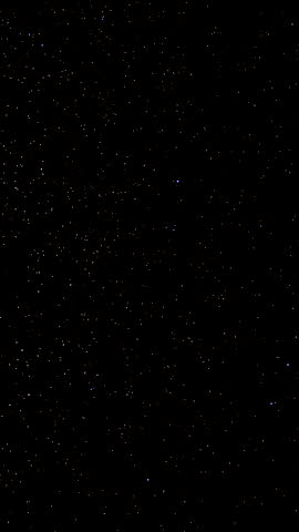 Time lapse of Star trails in the night sky. Stars move around a polar star, vertical footage