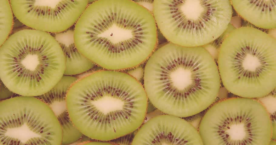 Flash sale text animation over sliced kiwi fruit background. Promotion, marketing, fresh, vibrant, fruits, healthy