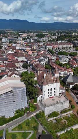 Historic town of Nyon, Switzerland aerial drone with medieval castle