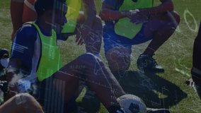Animation of financial data and graphs over diverse male soccer players during outdoor training. Sport, training, soccer, finance and economy concept digitally generated video. - Powered by Shutterstock - Get 15% off with code: PIKWIZARD15